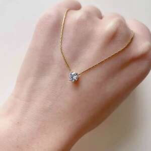 Gold Floating Solitaire Crystal Necklace – Radiant Diamond-Cut Pendant