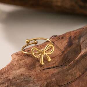 Golden Bow Statement Ring – Adjustable Open-Wrap Fashion Band